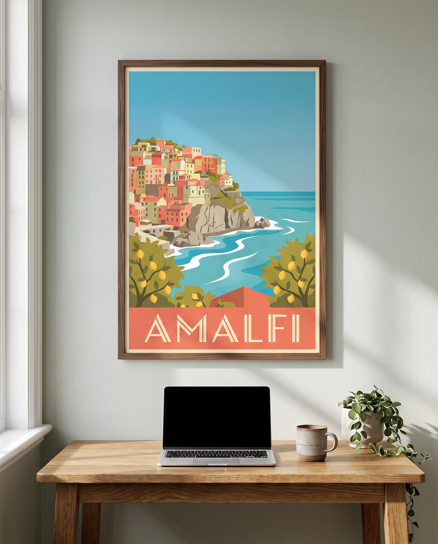 Amalfi travel poster framed in walnut above a home office desk