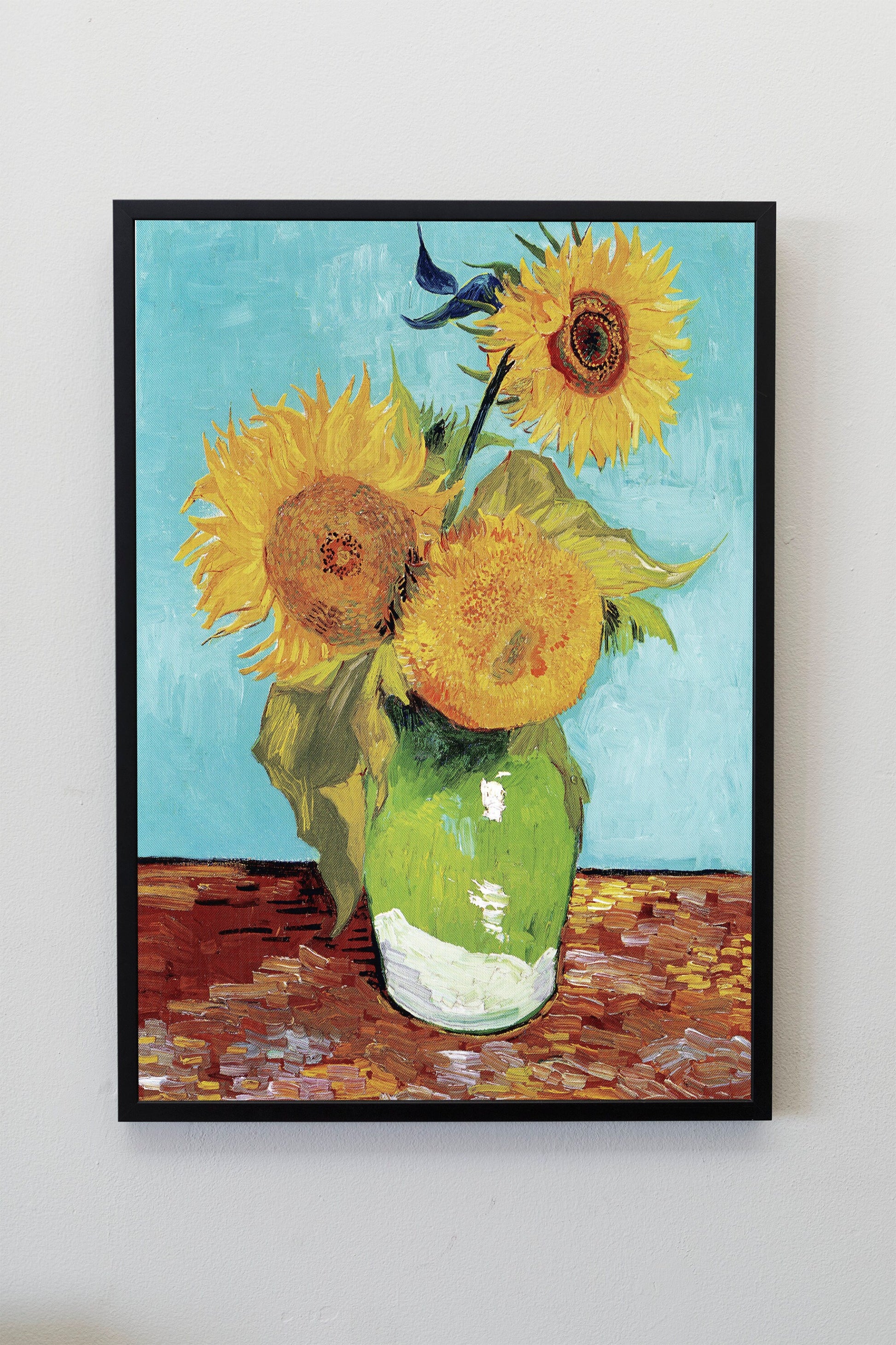 a painting of sunflowers in a green vase