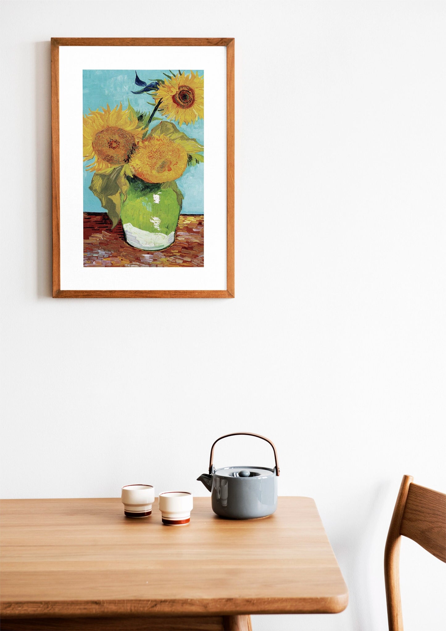 a painting of sunflowers in a vase on a table