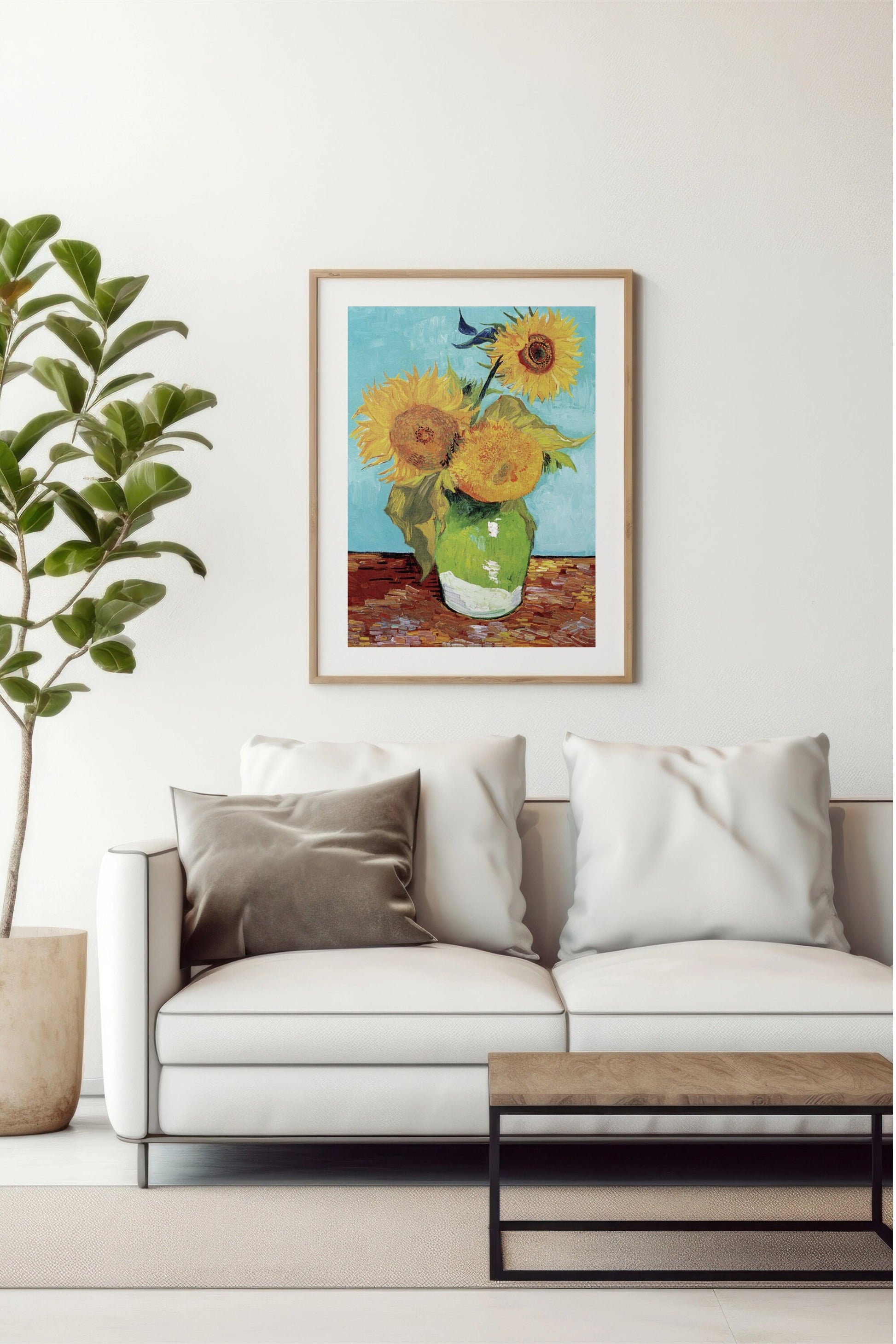 a painting of sunflowers in a vase on a white couch
