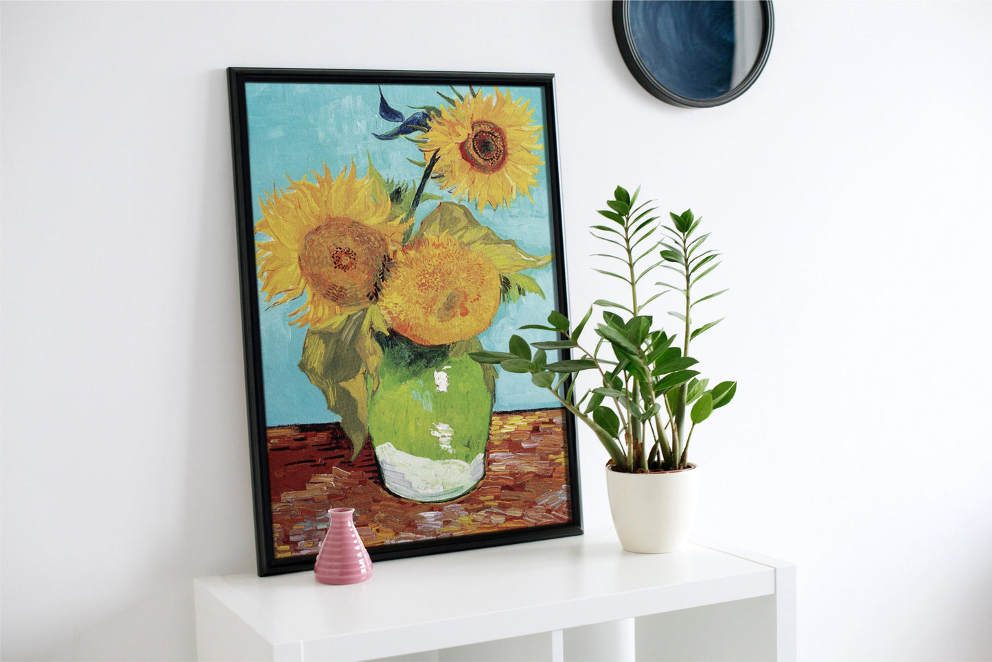 a painting of sunflowers in a green vase