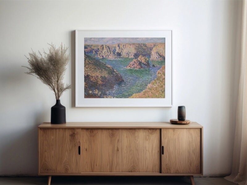 a painting hanging on a wall next to a wooden cabinet
