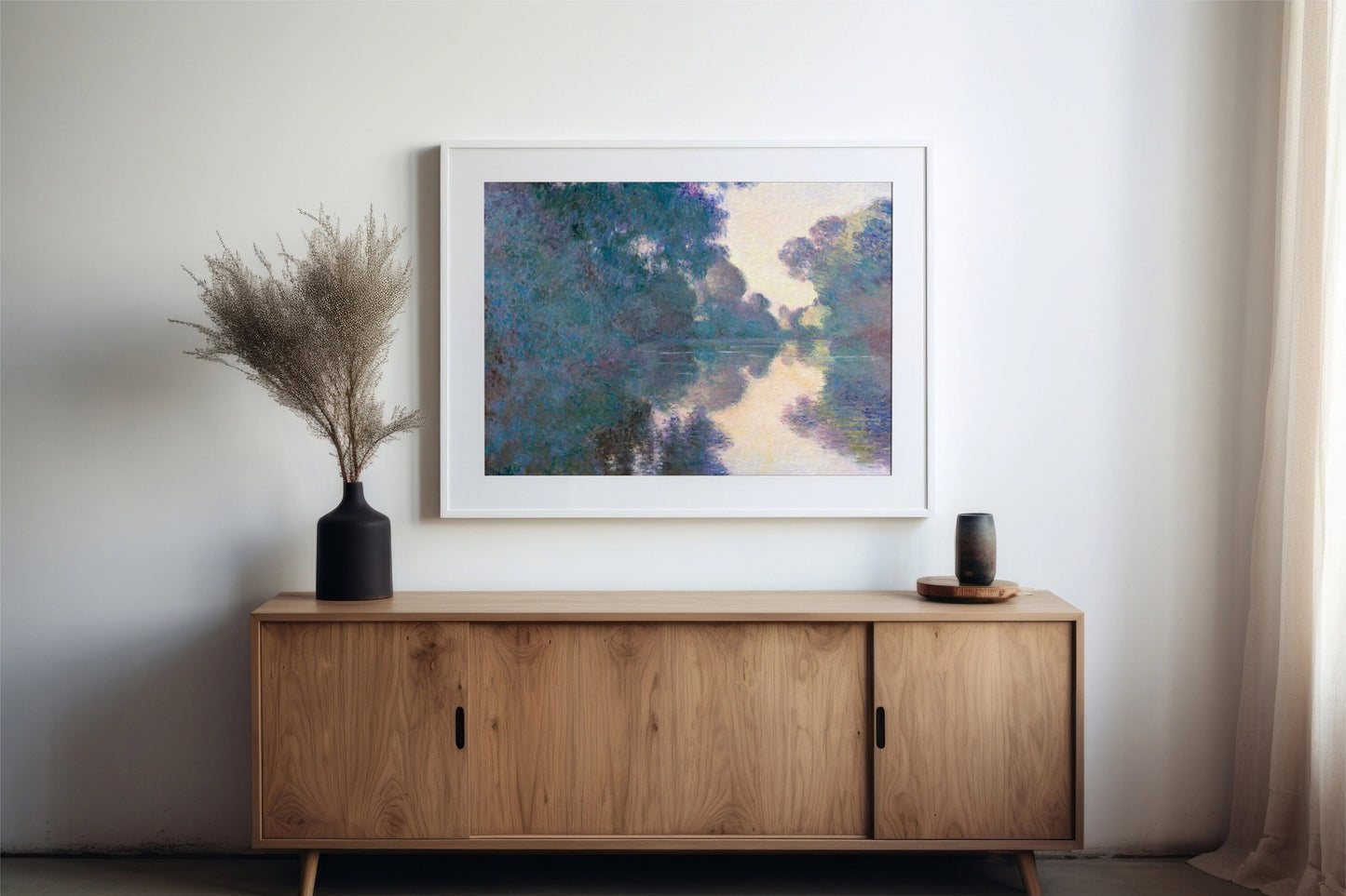 a painting hanging on a wall next to a wooden cabinet