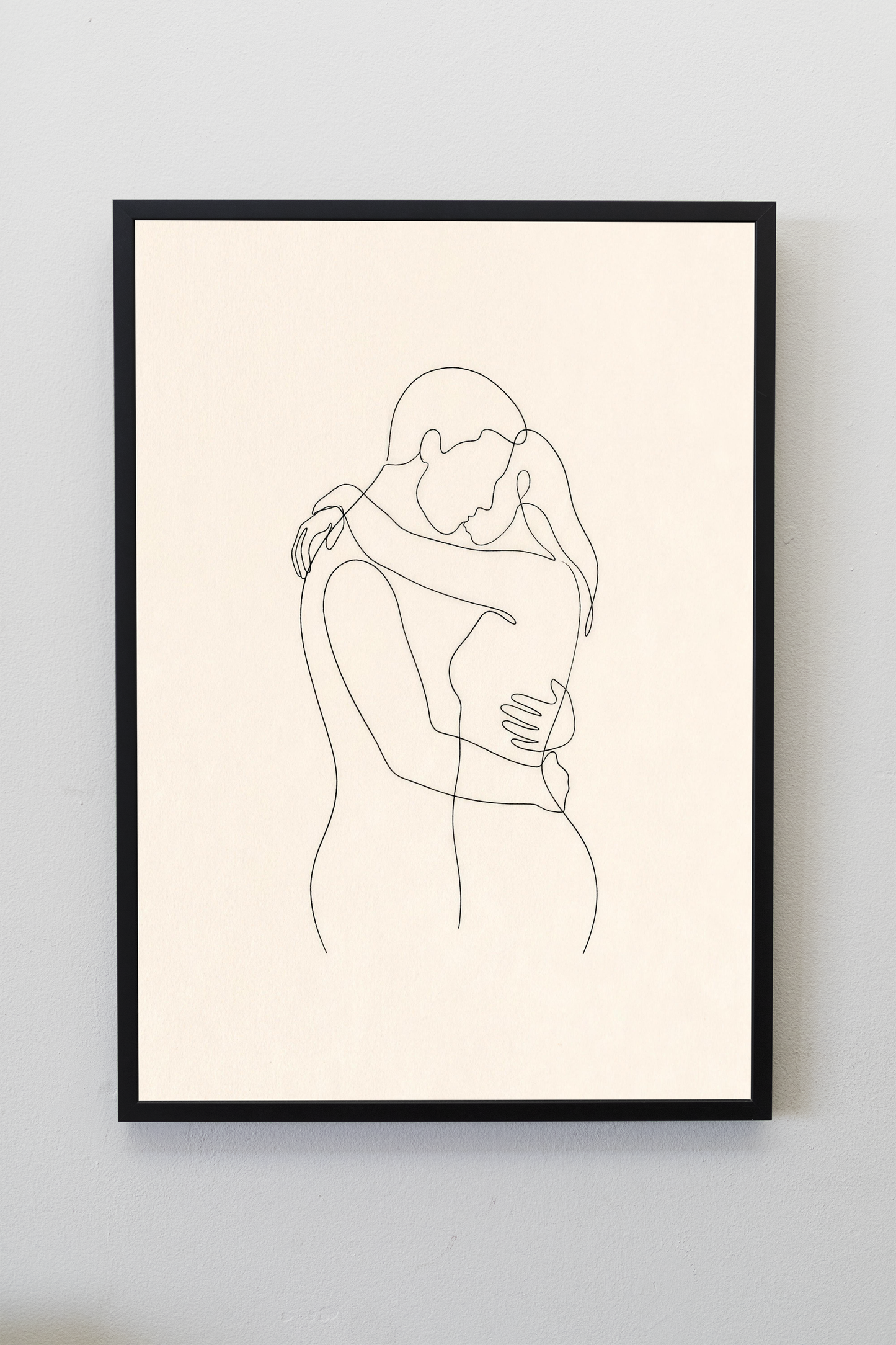The Embrace line art print framed on a gallery wall