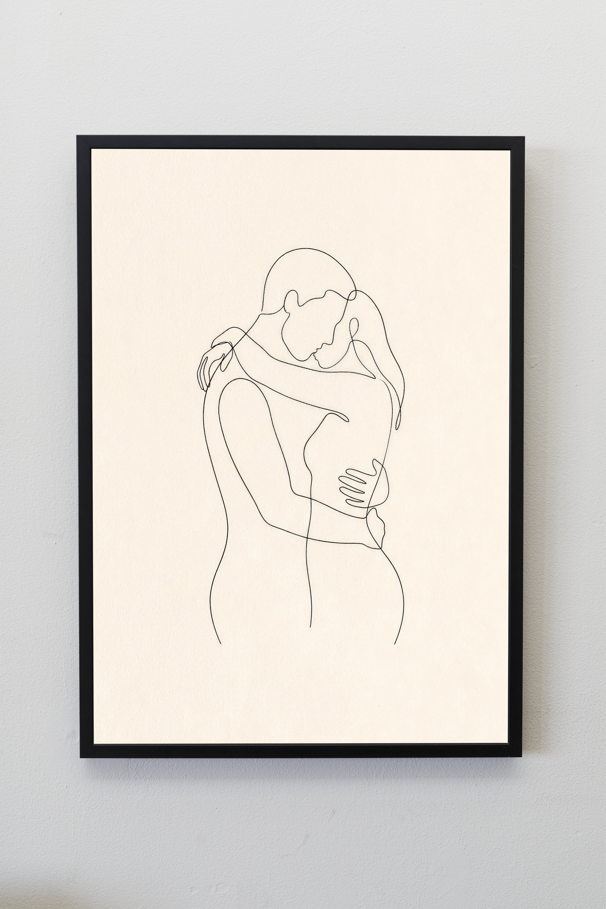 The Embrace line art print framed on a gallery wall