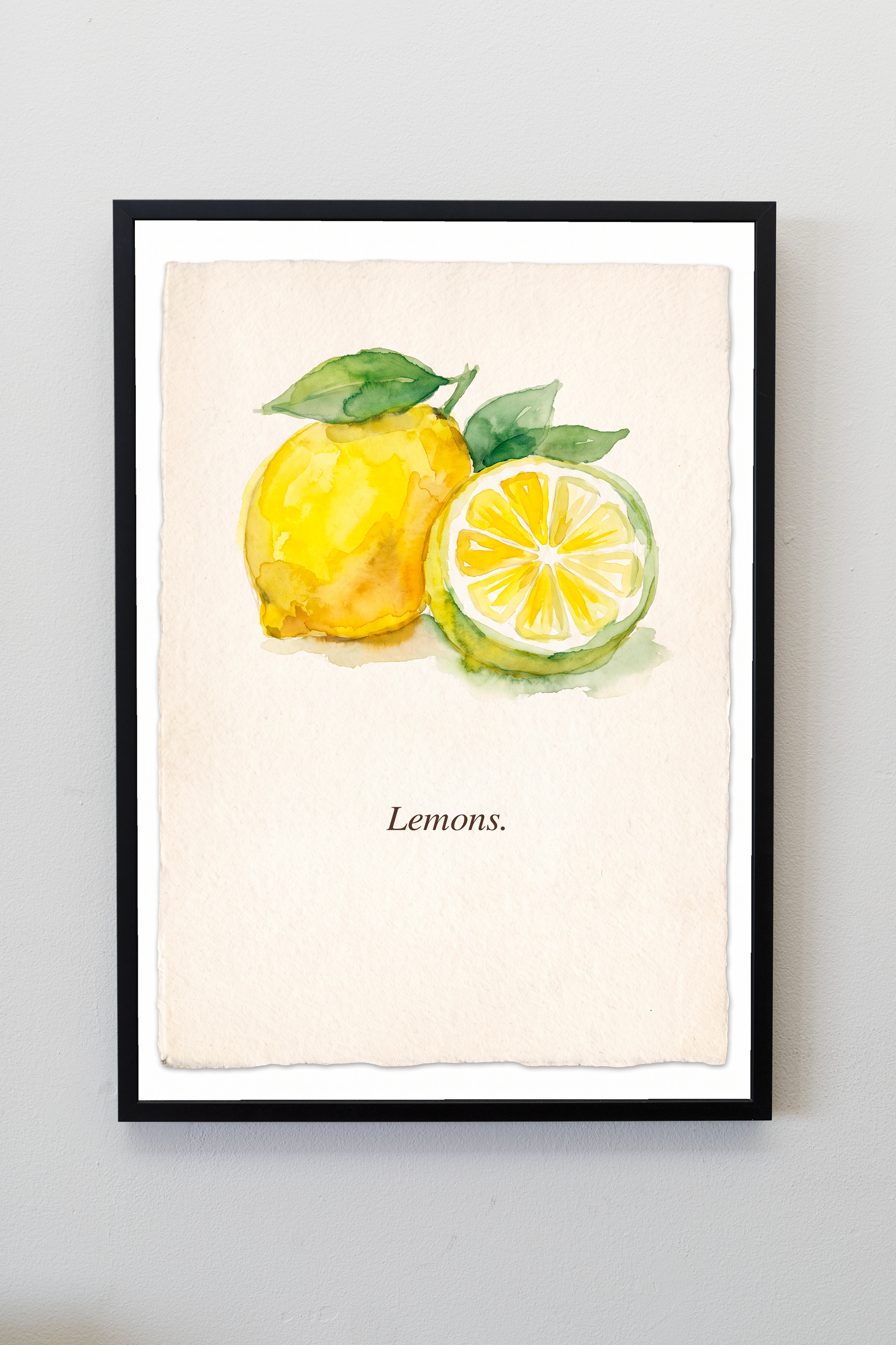 Lemons watercolour kitchen art print in a black frame on a warm white wall