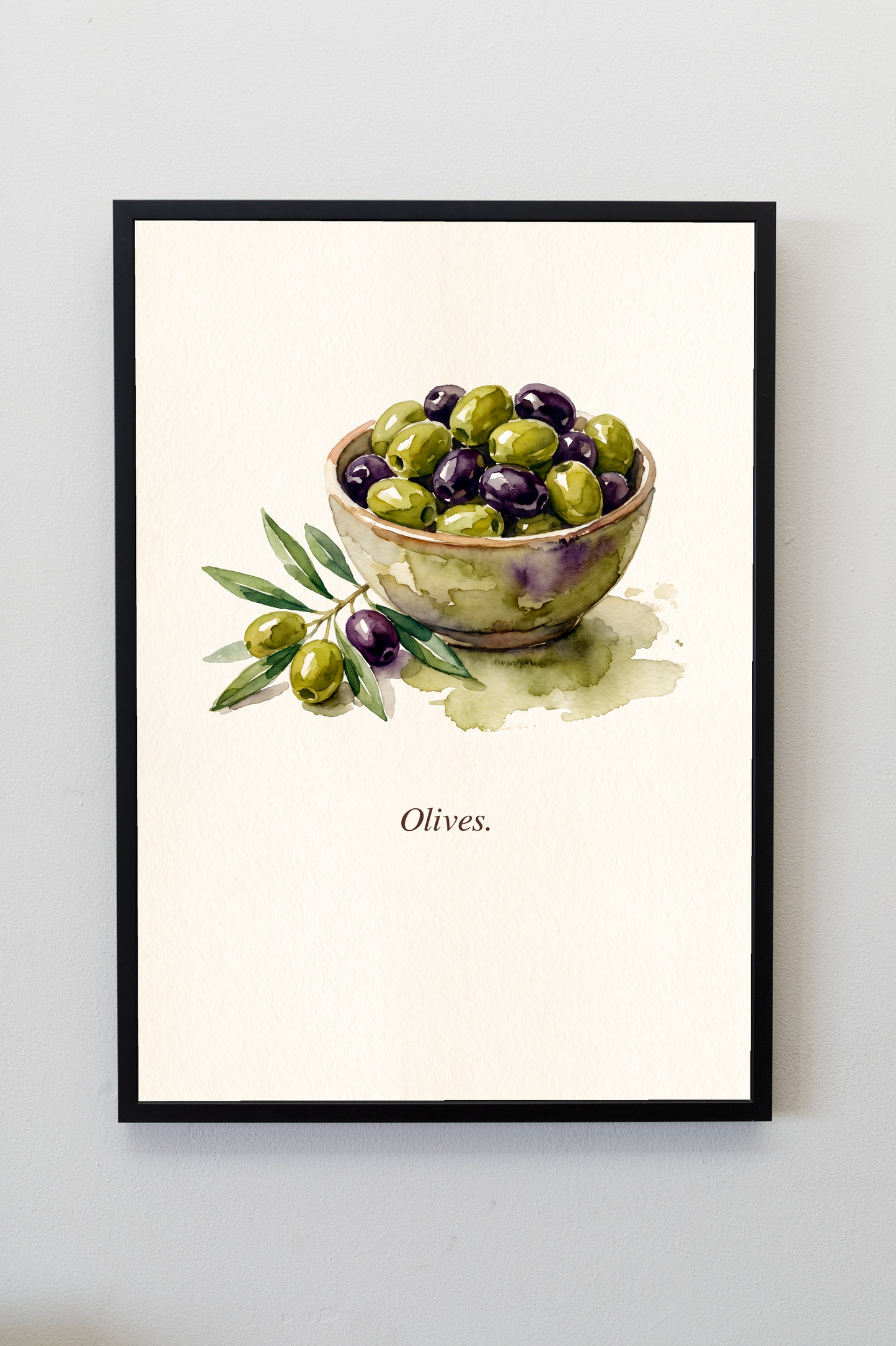 Olives watercolour kitchen art print in a black frame on a warm white wall