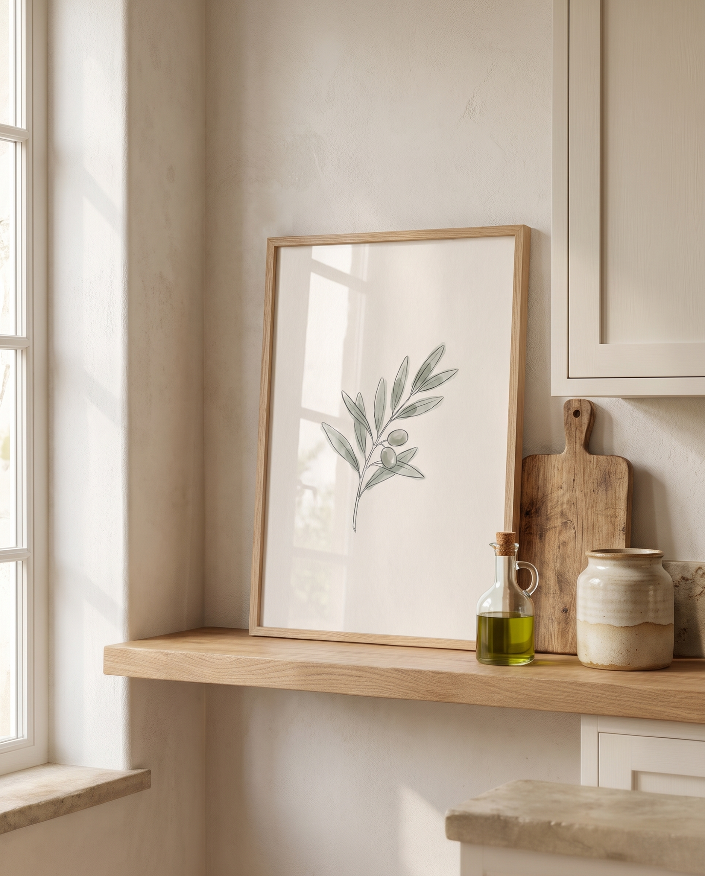 Olive Stem framed in oak on a kitchen shelf