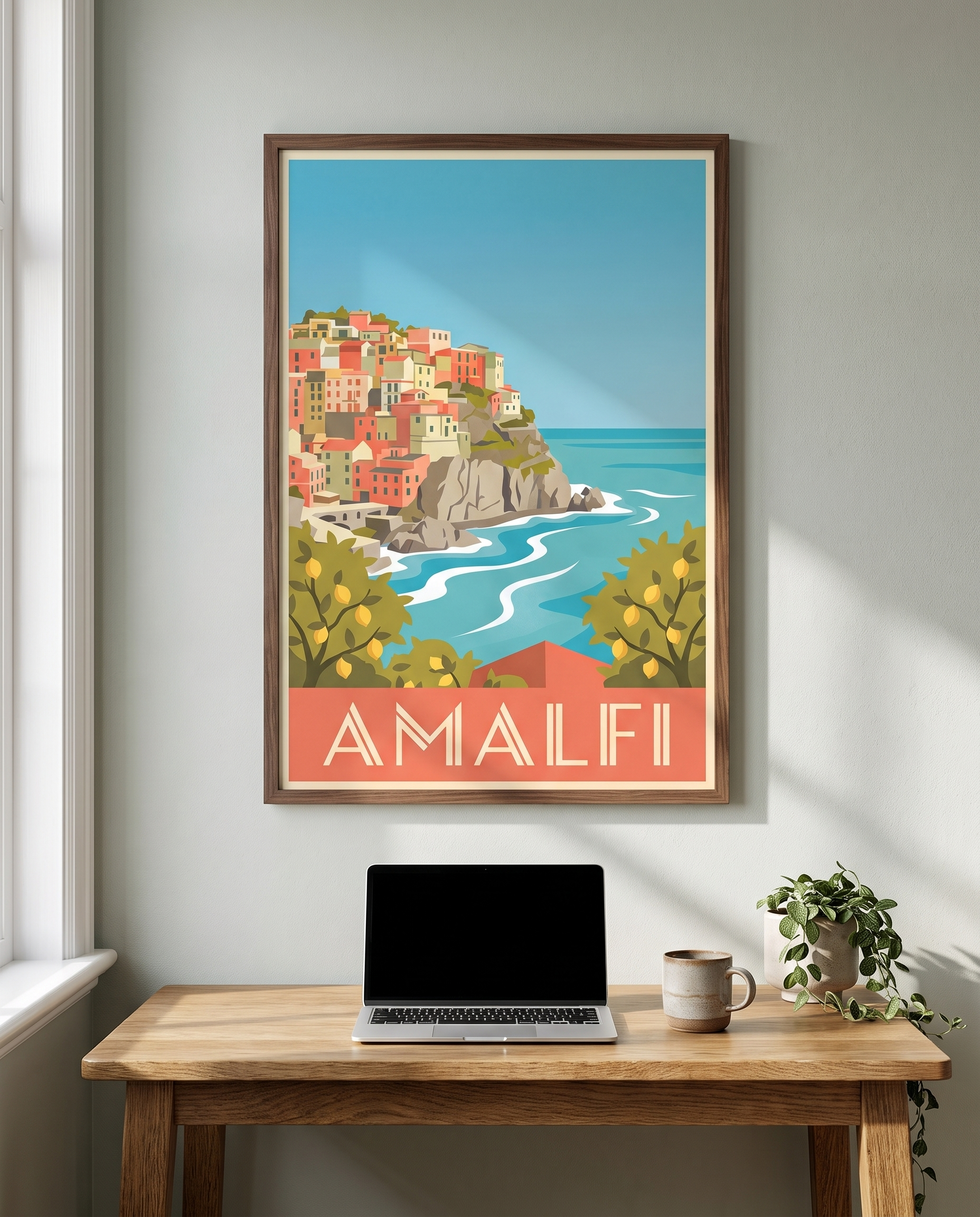 Amalfi travel poster framed in walnut above a home office desk