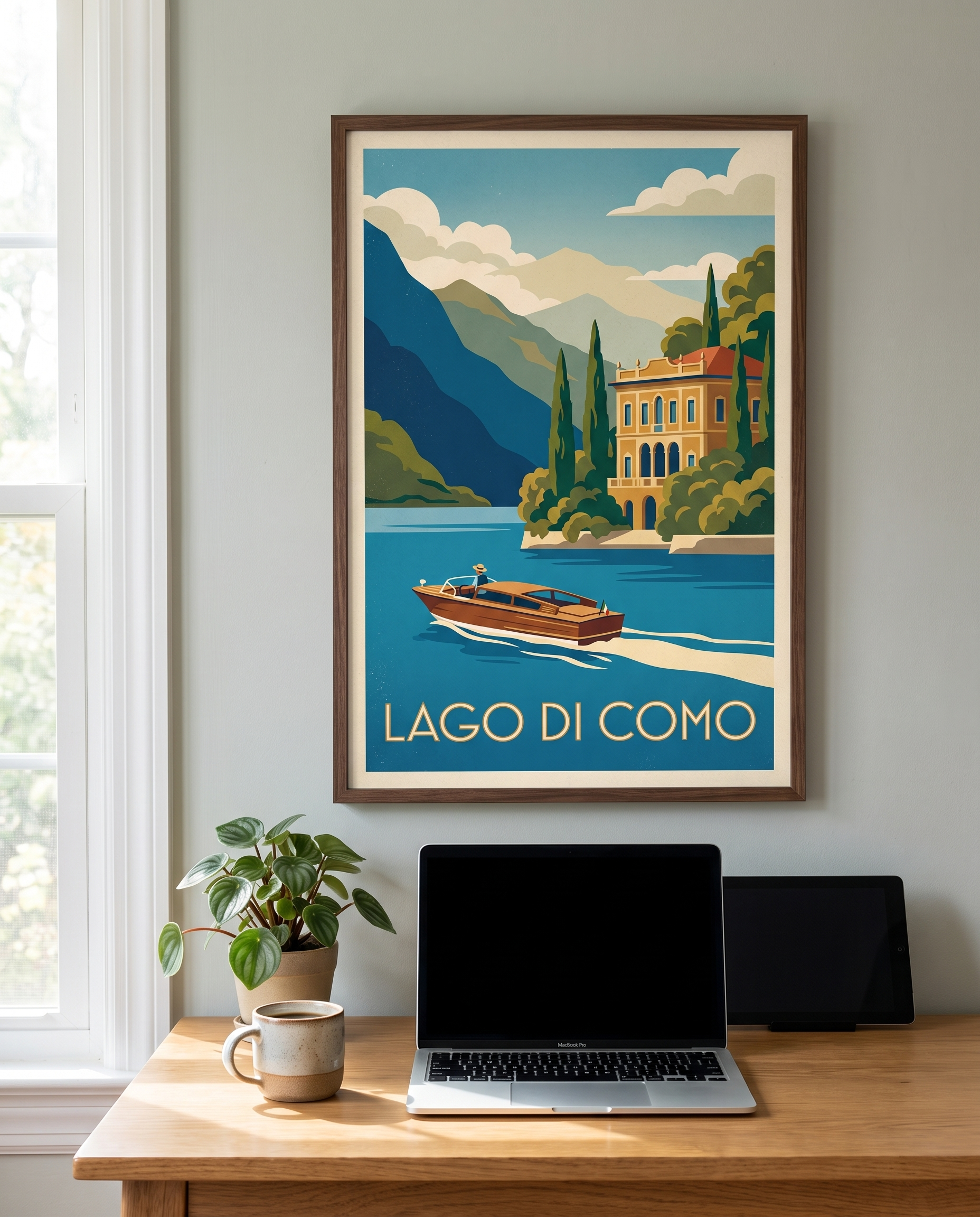 Lago di Como travel poster framed in walnut above a home office desk
