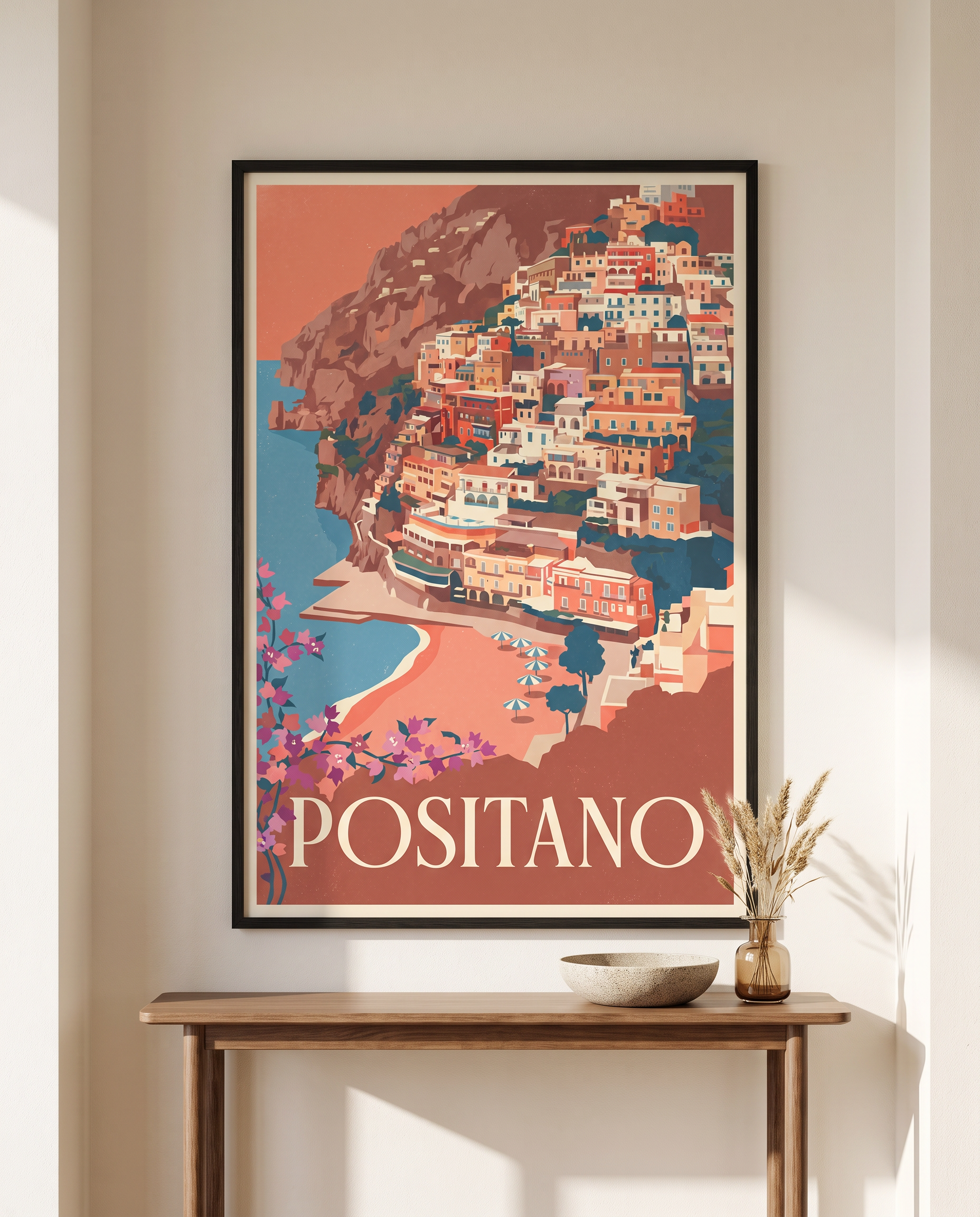 Positano travel poster framed in black above a hallway console table