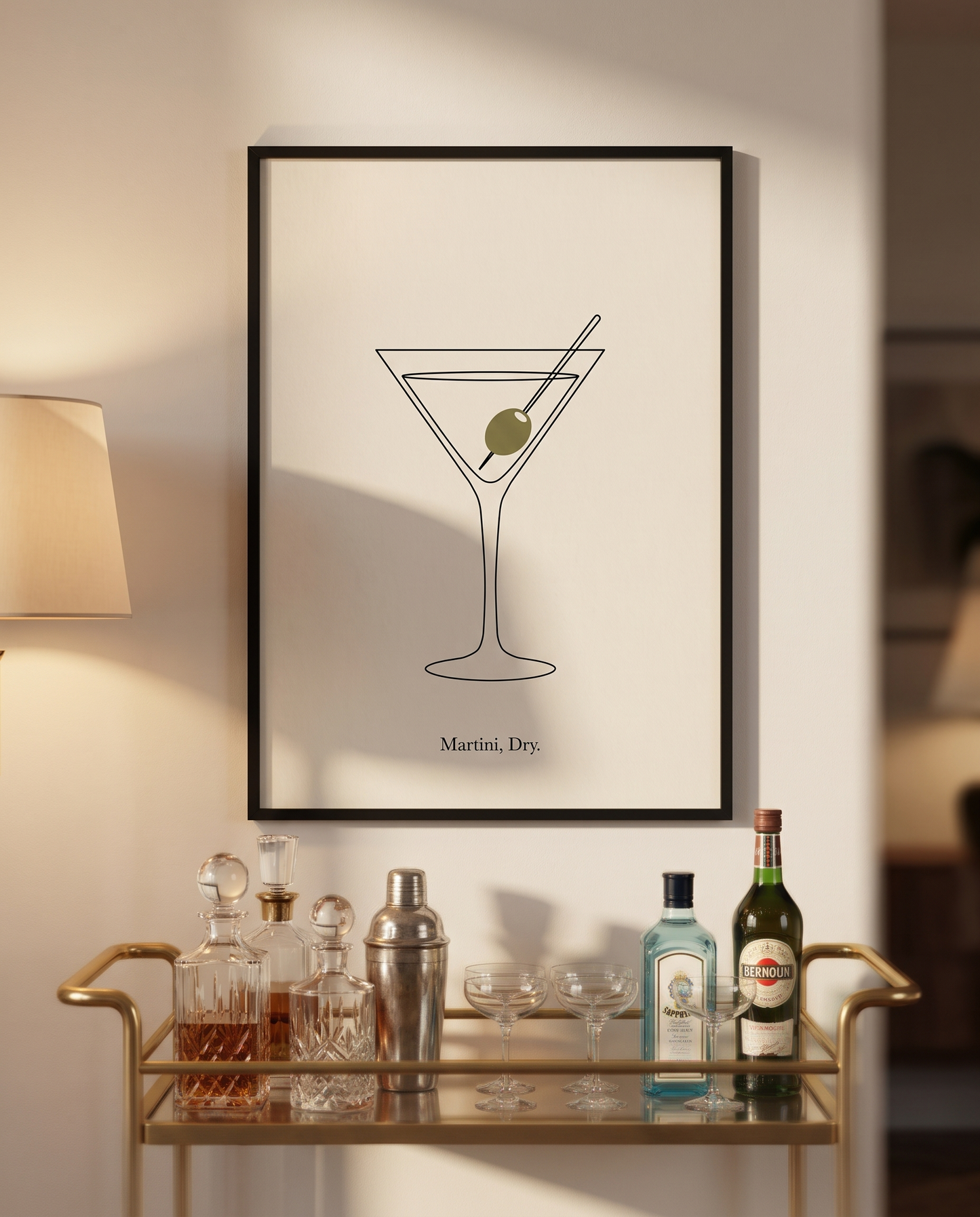 Martini Dry print framed in black above a brass bar cart