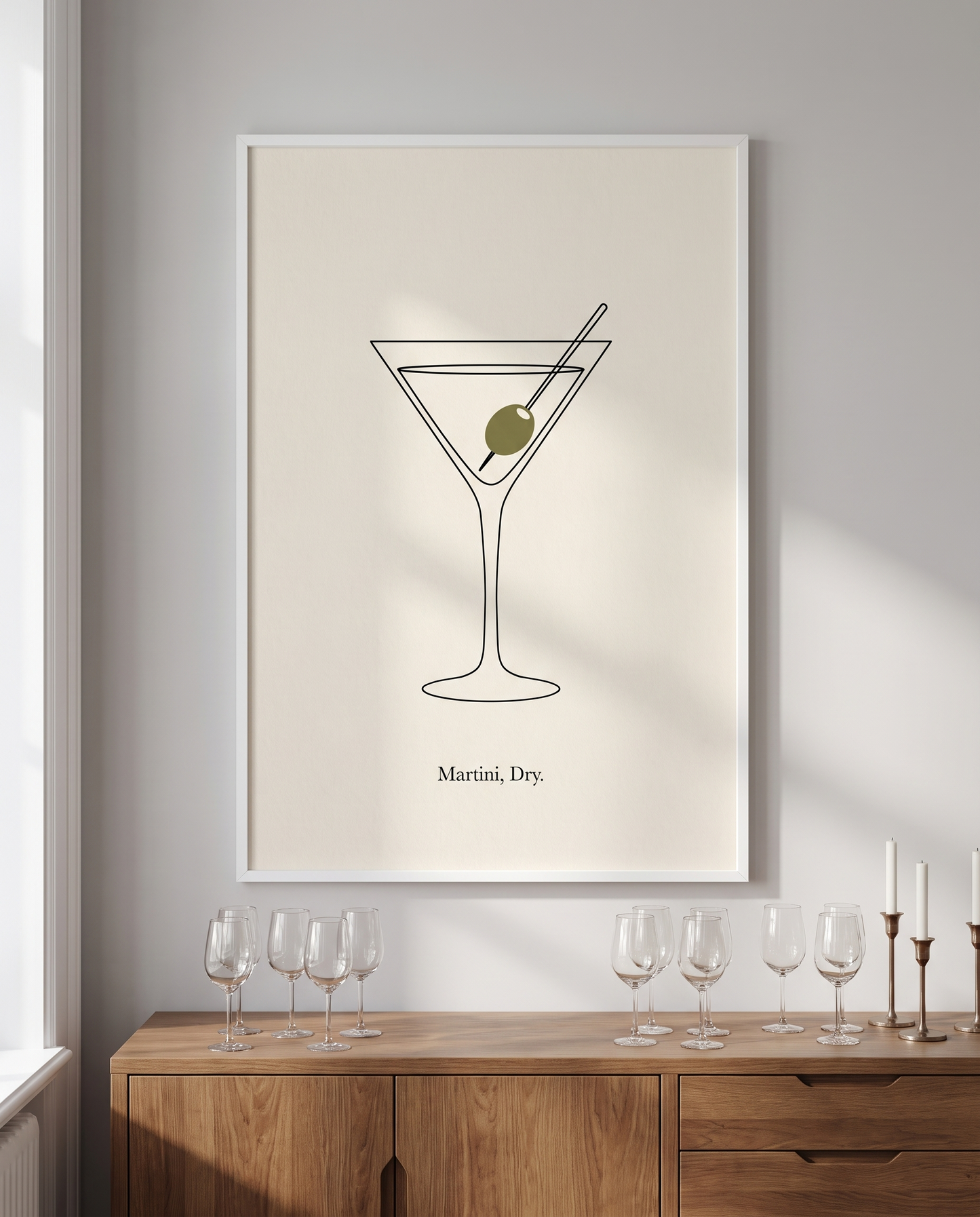 Martini Dry print framed in white above a dining room sideboard
