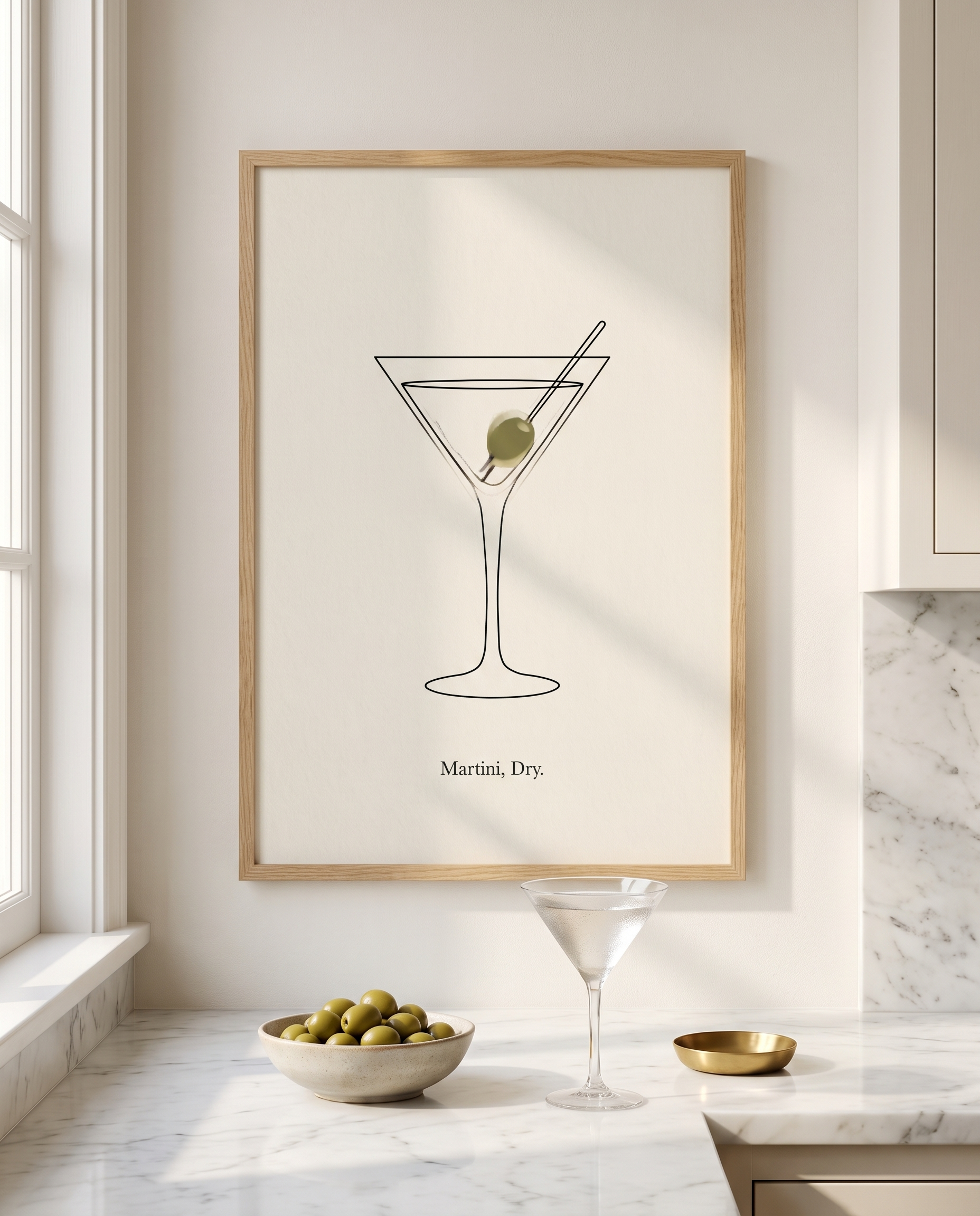 Martini Dry print framed in oak above a marble kitchen worktop