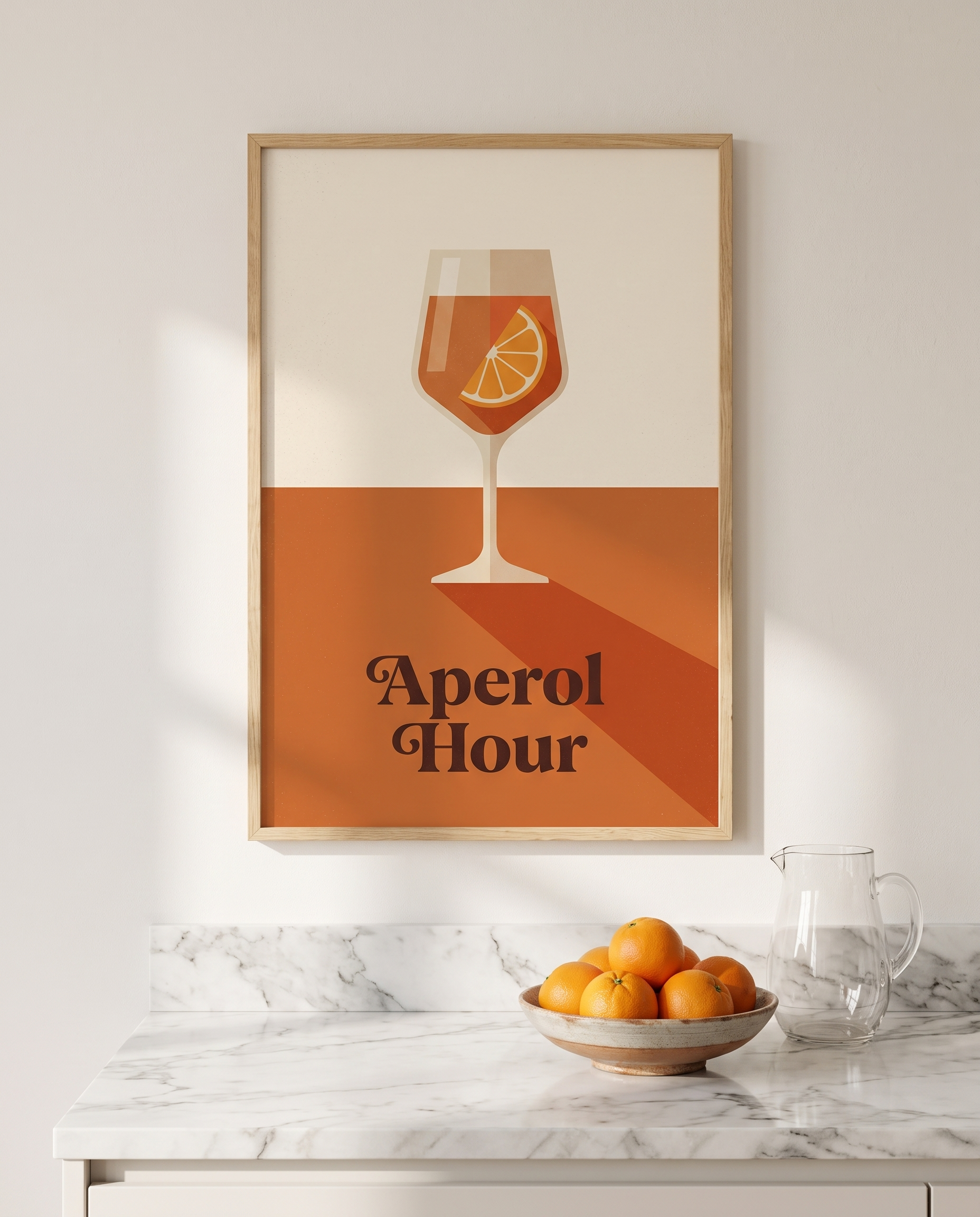 Aperol Hour print framed in oak above a marble kitchen worktop