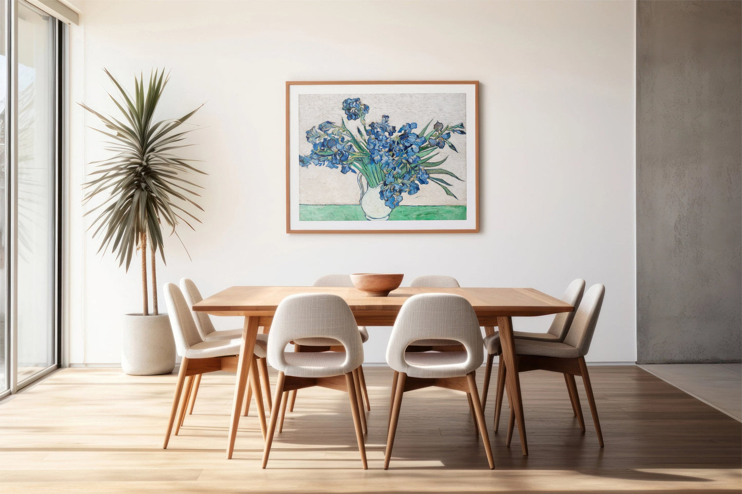 a picture of a vase with blue flowers on a table