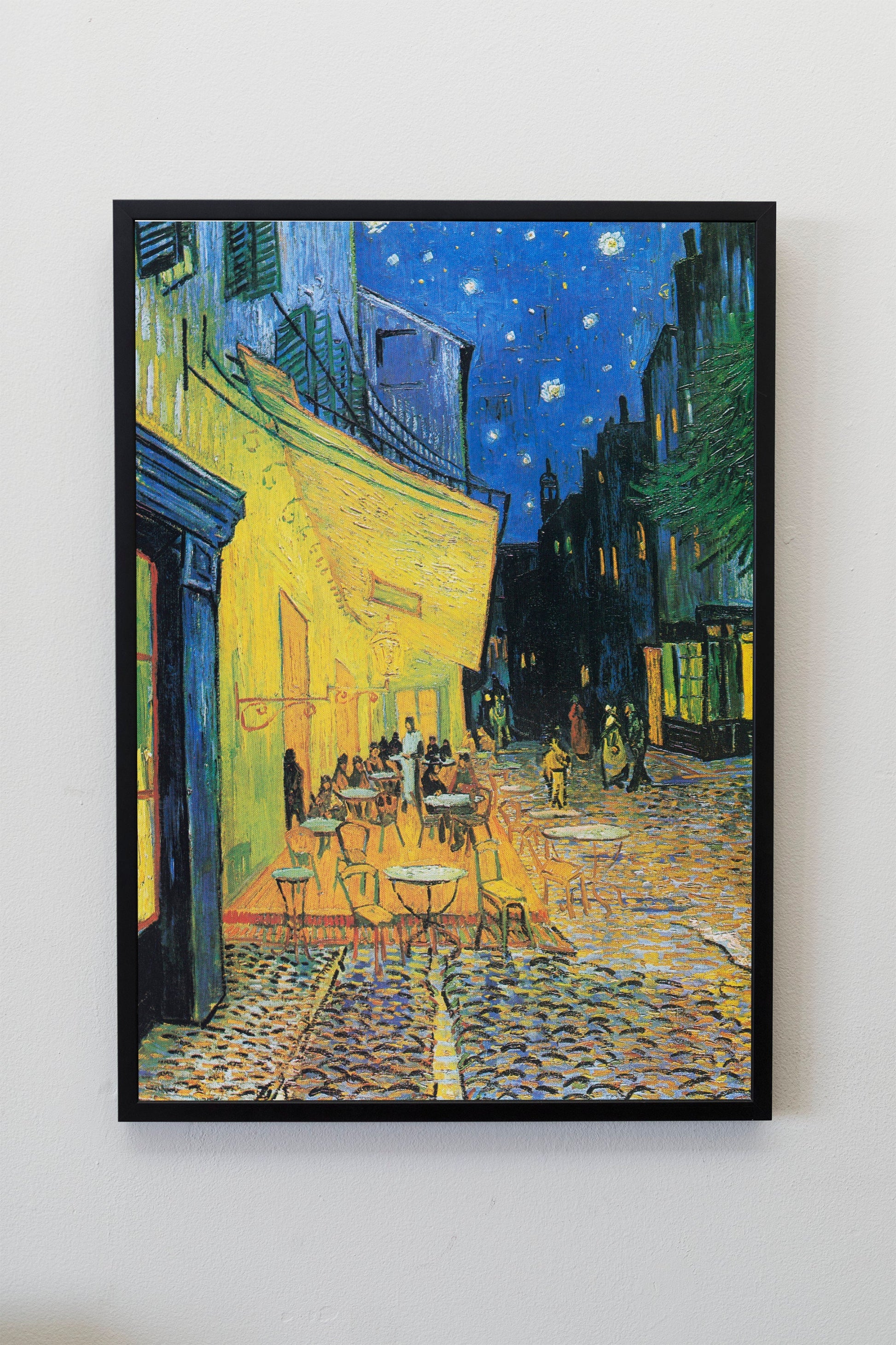 a painting on a wall of a street at night